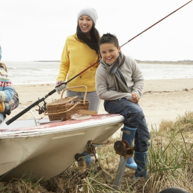 Family enjoying the outdoors fishing and boating